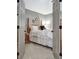 Bedroom with a wooden framed bed, neutral walls, and carpeted floor at 302 Welton Way, Peachtree City, GA 30269
