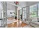 Inviting foyer featuring hardwood floors, soaring ceilings, and french doors leading into the space at 302 Welton Way, Peachtree City, GA 30269