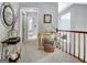 Hallway featuring a decorative table and artwork, leading to other rooms at 302 Welton Way, Peachtree City, GA 30269