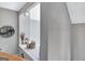 Hallway with an open area for decor leading to the tiled landing at 302 Welton Way, Peachtree City, GA 30269