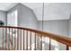 Hallway with wooden banister and a view of the front entrance at 302 Welton Way, Peachtree City, GA 30269