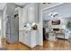 Well-lit kitchen showcasing stainless steel refrigerator and views of living room at 302 Welton Way, Peachtree City, GA 30269