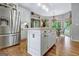 Beautiful kitchen with a large island, stainless steel refrigerator, and dining area at 302 Welton Way, Peachtree City, GA 30269