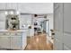 Open concept kitchen with island, modern lighting and view into living room at 302 Welton Way, Peachtree City, GA 30269