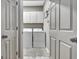 Bright laundry room with matching washer and dryer at 302 Welton Way, Peachtree City, GA 30269