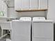 Laundry room with large sink, updated washer and dryer at 302 Welton Way, Peachtree City, GA 30269
