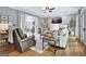 Bright living room features hardwood floors, comfortable seating, and a ceiling fan at 302 Welton Way, Peachtree City, GA 30269