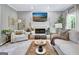 Bright living room with a large carpet and neutral tones is illuminated by natural light at 302 Welton Way, Peachtree City, GA 30269