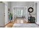 Bright sitting room with French doors and hardwood floors that connect to another living space at 302 Welton Way, Peachtree City, GA 30269