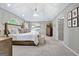 Spacious primary bedroom with vaulted ceiling and accent lighting at 302 Welton Way, Peachtree City, GA 30269