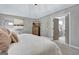 Bright main bedroom with gray walls, a decorative ceiling light and ensuite bathroom at 302 Welton Way, Peachtree City, GA 30269