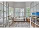 Comfortable sitting room featuring a sofa, bay windows, and view to the other living area at 302 Welton Way, Peachtree City, GA 30269