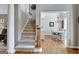 Staircase leading up to second floor with view to dining room at 302 Welton Way, Peachtree City, GA 30269