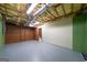 Spacious unfinished basement with open ceiling, painted walls, and ample potential for customization at 142 Pebblebrook Way, Temple, GA 30179