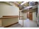 Unfinished basement features exposed ceiling, a workbench and ample potential at 142 Pebblebrook Way, Temple, GA 30179