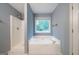 Relaxing bathroom featuring a soaking tub and shower at 142 Pebblebrook Way, Temple, GA 30179
