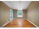 Formal dining room with hardwood floors and chandelier lighting at 142 Pebblebrook Way, Temple, GA 30179