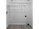 An empty laundry room with tile floors and washer/dryer hookups at 142 Pebblebrook Way, Temple, GA 30179