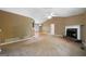 Living room with plush carpet, fireplace, and lots of natural light at 142 Pebblebrook Way, Temple, GA 30179