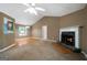 Open concept living room with fireplace and hardwood flooring at 142 Pebblebrook Way, Temple, GA 30179