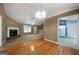 Living area with hardwood floors connecting to the living room at 142 Pebblebrook Way, Temple, GA 30179
