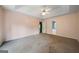 Large main bedroom with plush carpet, trey ceilings, and an en suite bathroom at 142 Pebblebrook Way, Temple, GA 30179