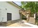 View of a wooden deck and basement door for this house with white siding at 40 Salem Ct, Mcdonough, GA 30252