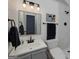 Bathroom featuring a white marbled shower, a mirror, and dark accents at 40 Salem Ct, Mcdonough, GA 30252