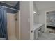 Bathroom featuring a shower, vanity with double sinks, and easy access to the main bedroom at 40 Salem Ct, Mcdonough, GA 30252