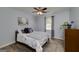 Comfortable bedroom with a soft rug, accent wall art, and a bright window at 40 Salem Ct, Mcdonough, GA 30252