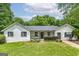 Charming single-story home with white siding, black shutters, and a well-manicured front lawn at 40 Salem Ct, Mcdonough, GA 30252