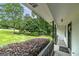 Inviting covered front porch with manicured landscaping at 40 Salem Ct, Mcdonough, GA 30252