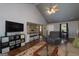 Open-concept living area features vaulted ceiling, fireplace, and seamless flow to kitchen at 40 Salem Ct, Mcdonough, GA 30252