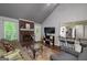 Bright living room with fireplace, wood floors, and views into the kitchen at 40 Salem Ct, Mcdonough, GA 30252