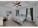 Cozy main bedroom boasts tray ceilings, an area rug, and large windows with lovely curtains at 40 Salem Ct, Mcdonough, GA 30252