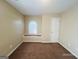 Neutral bedroom with carpet and a window nook that provides natural light at 6190 Winston Trce, Mcdonough, GA 30252