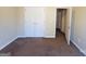 Bedroom featuring double closet doors and natural light from an open doorway at 6190 Winston Trce, Mcdonough, GA 30252