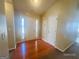 Bright foyer with hardwood floors and a welcoming entrance at 6190 Winston Trce, Mcdonough, GA 30252