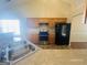 Well-lit kitchen with stainless steel appliances, light wood cabinetry, and a dual basin sink at 6190 Winston Trce, Mcdonough, GA 30252