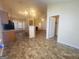 The kitchen is open concept, connecting to other living spaces, and has tiled floors at 6190 Winston Trce, Mcdonough, GA 30252