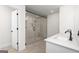 Modern bathroom showcasing a walk-in shower, double vanity, tile floor, and quartz countertops at 615 Cantrell Drive, Dallas, GA 30157