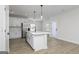 Stylish kitchen with white cabinets, a center island, stainless steel appliances, and wood flooring at 685 Cantrell Drive, Dallas, GA 30157