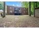 A large brick home with back deck and patio at 871 Rocky Creek Rd, Hampton, GA 30228