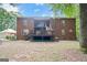 A large brick home with back deck and patio at 871 Rocky Creek Rd, Hampton, GA 30228