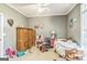 A simply decorated bedroom with carpet and ample natural light at 871 Rocky Creek Rd, Hampton, GA 30228