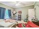 Neutral carpeted bedroom featuring natural light at 871 Rocky Creek Rd, Hampton, GA 30228