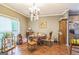 Cozy dining area with hardwood floors and room for Gathering meals and gatherings at 871 Rocky Creek Rd, Hampton, GA 30228