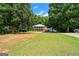 Spacious two-story home with a long driveway and plenty of parking at 871 Rocky Creek Rd, Hampton, GA 30228