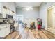 Open kitchen and dining area with appliances and bright, natural light at 871 Rocky Creek Rd, Hampton, GA 30228