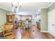 Open-concept kitchen featuring hardwood floors, wood cabinetry, and ample space for cooking and dining at 871 Rocky Creek Rd, Hampton, GA 30228